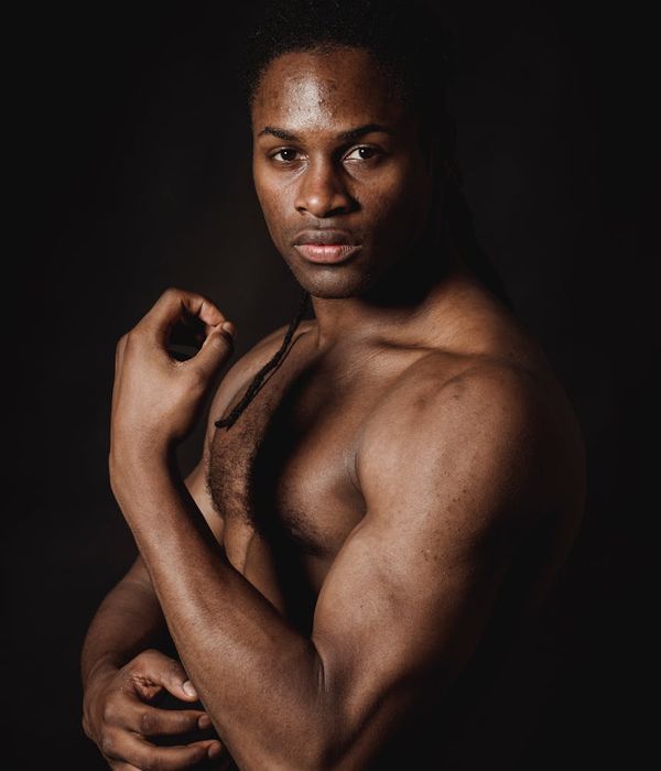 Man in a powerful and stable athletic pose.